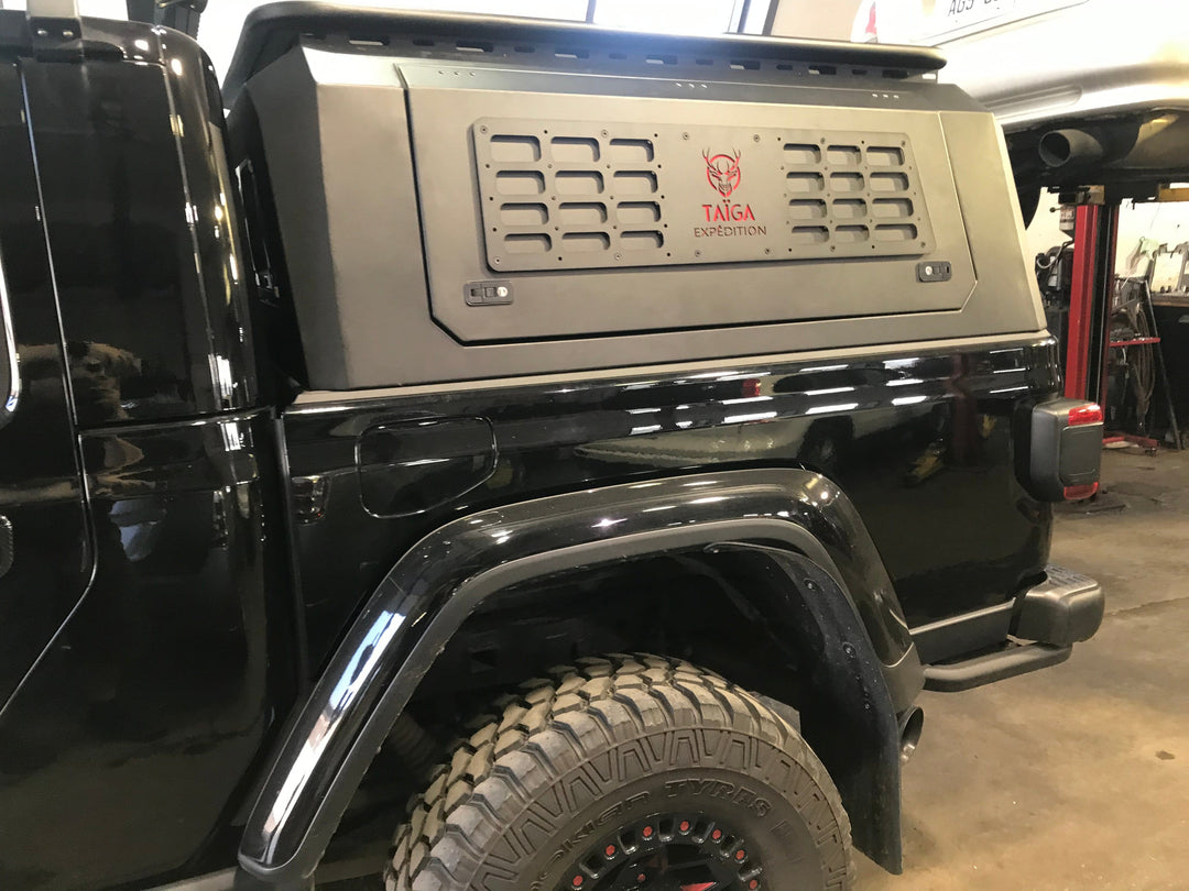 Image of a truck with an aluminum bed.